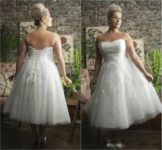 the woman is wearing a white dress and posing for pictures in front of a stone wall