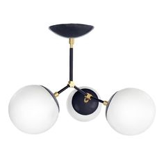 three light chandelier with black and white glass balls hanging from it's arms