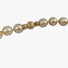 Introducing an amazing quality genuine Golden South Sea pearl necklace, complete with a 14K yellow gold 'twist and lock' clasp, designed to add an extra touch of luxury to this already stunning piece. This necklace features a beautiful array of light gold cultured Golden South Sea pearls, farmed in Indonesia. The pearls are graduated in size, ranging from 11 to 12mm, and showcase a captivating high luster that further enhances their already impressive appearance. Pearls are semi-baroque/oval in Luxury Single Strand Yellow Gold Pearl Necklace, Luxury Yellow Gold Pearl Necklace With Round Beads, Elegant Gold Pearl Necklace With Sterling Silver Clasp, Formal Yellow Gold Pearl Necklace With Round Beads, Luxury Pearl Necklace With Sterling Silver Clasp, South Sea Pearl Necklace, Golden South Sea Pearls, Sea Pearl, South Seas