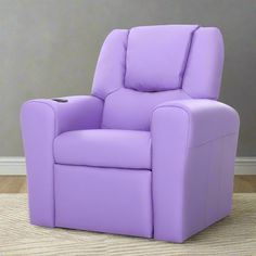 a purple recliner chair sitting on top of a hard wood floor