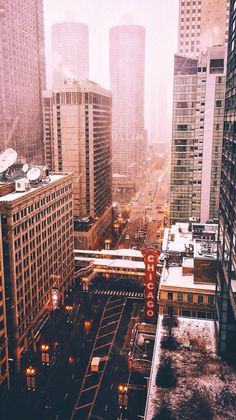 the city is covered in snow and fog