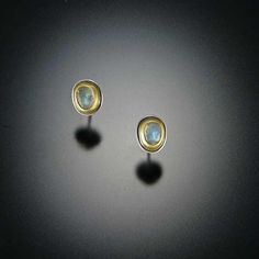 Hints of many colors illuminate from these lovely labradorite stud earrings. Set in bezels of 22k gold or fine silver (choose below,) backed with sterling silver. Delicate and elegant. Earrings measure approximately 3/16 inch across at the widest point. Matte finish. Each stone is unique and may vary slightly from the image. Pendulum Earrings, Gold Bar Earrings Studs, Diamond Fashion Jewelry, Gold Bar Earrings, Bar Stud Earrings, Circle Earrings Studs, Tiny Stud Earrings, Circle Studs, Birthstone Earring