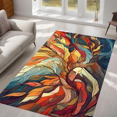 a colorful area rug with an abstract tree design