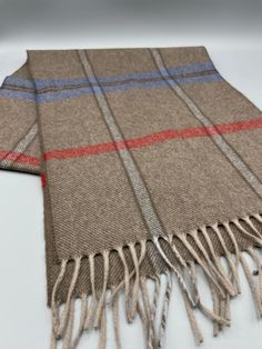 "100% Merino Wool Made in West Germany Plaid Scarf in Excellent Condition Description * Warm luxurious Merino wool * Brown/Beige background with blue and red plaid * Excellent condition * Fringe  * 53\" long * 11\" wide (SBFILE1)" Woolen Scarves, Winter Scarves, Merino Wool Scarf, Wool Winter, Beige Background, West Germany, Mock Neck Sweater, Wool Scarf, Beige Brown