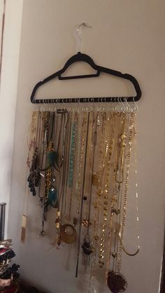 a rack with many necklaces hanging from it