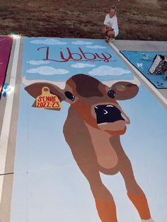 a painting of a cow on the ground