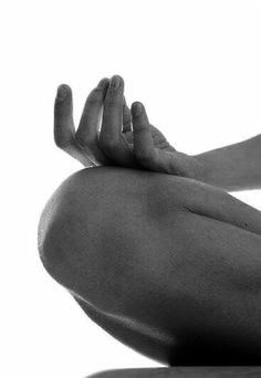 black and white photograph of a person doing yoga