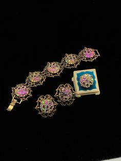 "This color changing set is oh so pretty; each round 'stone' in the bracelet and clip earrings is set in a decorative brass colored metal which measures 1 1/2\" long by 1 1/2\" wide; the ring is set in a simple setting of the same colored metal; depending on the angle, the colors reflect blue, pink, green, yellow or orange; bracelet is 7 1/2\" long, and each 'stone' is 7/8\" round; dress up or down." Round Dress, Orange Bracelet, Pink Green Yellow, Decal Paper, Bronze Jewelry, Stone Inlay, Tickled Pink, Vintage Color, Clip Earrings