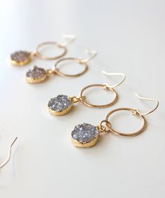 Our NEW Rey Druzy Circle Drop Earrings are a perfect go to option for your work day to your date night. This lightweight, classic design features natural druzy drops in neutral hues and 14k gold filled circles that are lightly hammered for added texture and shimmer. Ordering 4 or more for Bridesmaids or a special occasion? Please contact us for special pricing and stock availability.*CUSTOMIZE by selecting the exact set of Druzy drops you love! See photos for Druzy set options.MATERIALS: Natural Everyday Nickel-free Teardrop Crystal Earrings, Elegant Nickel-free 14k Gold-filled Teardrop Earrings, Nickel-free 14k Gold-filled Round Earrings, 14k Gold-filled Teardrop Natural Stone Earrings, Boho Hoop Earrings, Hammered Hoop Earrings, Druzy Earrings, Large Earrings, Sterling Silver Hoops