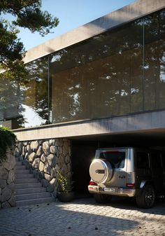 a jeep parked in front of a building with stone steps leading up to the entrance