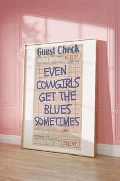 a poster with the words even cowgirls get the blues sometimes in front of a pink wall