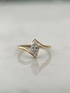 a diamond ring sitting on top of a table