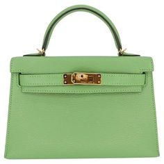 Brand: Hermès Style: Kelly II Sellier Mini Size: 20cm Color: Vert Criquet Material: Chevre Leather Hardware: Gold Hardware(GHW) Dimensions: 7.5" W x 4.5" H x 2.25" D Handle Drop: 3.25" Strap Drop: 18.5" Mini Kelly, Hermes Style, Hermes Box, Leather Hardware, Hermes Paris, Hermes Handbags, New Handbags, Box Set, Birkin Bag