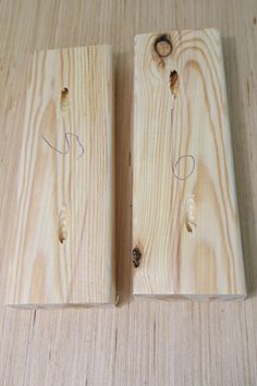 two pieces of wood with holes in them