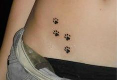 a woman's stomach with paw prints on it