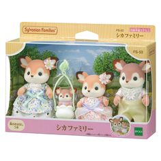 three little stuffed animals are in a box with the packaging on it's side