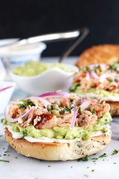 a sandwich with meat and guacamole on it