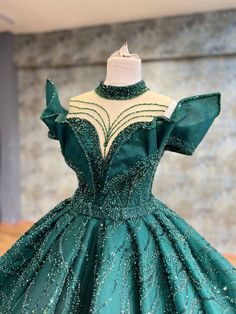 Majestic Green Ball Gown with Beaded Embellishments, High Neckline, and Layered Skirt Green Ball Gown, Beaded Embellishments, Green Dresses, Layered Skirt, High Neckline, Luxury Fabrics, Exclusive Collection, Ball Gown, Luxury Wedding