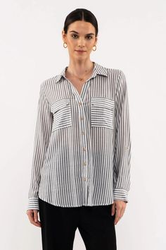 Introducing Sammy's Stripes: the perfect blend of office-approved and fun-loving fashion! Our lightweight blouse features a classic double pocket and button up design adorned with faded black stripes 100% Rayon - so you can go from the boardroom to the bar in effortless style! Casual Shirt With Vertical Stripes For Office, Casual Black Blouse With Vertical Stripes, Black Casual Blouse With Vertical Stripes, Casual Striped Blouse For Business Casual, Casual Striped Blouse For Work, Casual Striped Office Blouse, Business Casual Vertical Stripes Button-up Tops, Casual Striped Blouse For The Office, Vertical Stripes Button-up Workwear Shirt