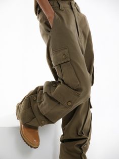 Chic and trendy oversized wide leg cargo pants in 100% cotton. Three pockets down outside leg with snap button closure detail. Model is in MINUSEY S. ✔️ Free worldwide express shipping over $100✔️ Loved by 6,500+ customers✔️ Limited edition collections, maximum styleStay ahead of the trend with can’t-find-anywhere-else staples. Your closet will thank you 💕 * MINUSEY S = EU 34, US 2* MINUSEY M = EU 36, US 4* 100% Cotton* Dry clean* Made in Korea - Model Height: 169cm/5'6" (US2, EU34) Military Style Baggy Wide Leg Parachute Pants, Spring Military Wide Leg Cargo Pants, Spring Military Style Wide Leg Cargo Pants, Spring Military Wide-leg Cargo Pants, Utility Cotton High-waisted Parachute Pants, Military Wide Leg Cargo Bottoms, Military Style Wide Leg Cargo Bottoms, Oversized Wide Leg Utility Pants, Military Cargo Style Wide Leg Bottoms