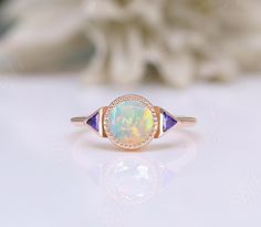 This ring can be made with your desired gemstone as well. If you would prefer a custom ring, please contact us before purchase. You You may also visit our following shops for varieties of collection :- ★ ★ ★ ★ ★ ★ ★ ★ ★ https://www.etsy.com/shop/OGofJewelry https://www.etsy.com/shop/BeckyBjewelry https://www.etsy.com/shop/TravelBugJewelry https://www.etsy.com/shop/BellaLaBellaJewelry https://www.etsy.com/shop/WanderlustJewelryArt https://www.etsy.com/shop/BloozieBlueJewelry ★ ★ ★ ★ ★ ★ ★ ★ ★ Thi Art Deco Sapphire Ring With Accent Stones For Wedding, Art Deco Sapphire Wedding Ring With Accent Stones, Unique Round Birthstone Ring For Anniversary, Wedding Sapphire Ring With Bezel Setting, Unique Round Cut Sapphire Wedding Ring, Art Deco Diamond Ring With Accent Stones, Unique Opal Ring With Bezel Setting For Anniversary, Unique Round Cut Sapphire Ring For Wedding, Unique Round Sapphire Ring For Wedding