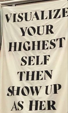 a sign that says visualize your highest self then show up as her