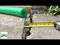 there is a measuring tape next to a pool noodle