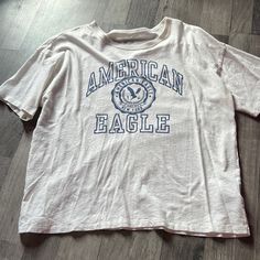 White American Eagle Tee Never Worn Size Medium Cheap American Retro Crew Neck T-shirt, American Eagle Shirts For Men, American Eagle 2000s, American Eagle Tops, American Eagle Shirts, American Eagle Graphic Tees, American Eagle T Shirts, American Eagle Shirt, Eagle Tee