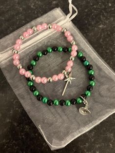 Glinda and Elphaba themed friendship bracelets, perfect for if you are going to see Wicked! *Please note the shades of the beads may vary slightly Wicked Friendship Bracelet, Wicked Bracelet, Glinda And Elphaba, Elphaba And Glinda, Bead Ideas, Braided Bracelets, Disney Inspired, Friendship Bracelets, Diy Jewelry