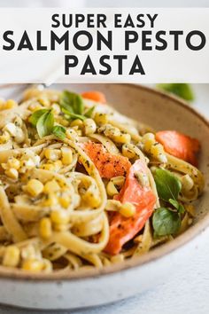 a bowl filled with pasta and vegetables on top of a table