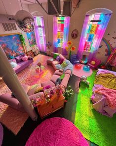 a room filled with lots of colorful furniture and decor on top of carpeted flooring