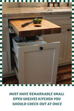 a kitchen with an open drawer and cutting board