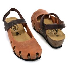 The Amy is a closed toe, open back sandal with amazing ventilation and support. Plakton had both comfort and style in mind with the construction of these fun nubuck leather sandals. A multi-point velcro closure ensures a proper fit and ample adjustment. Finishing off with a firmer footbed for maximum support, you'll be walking through your day with ease! Brown T-strap Sandals With Leather Footbed And Closed Toe, Brown Closed Toe T-strap Sandals With Leather Footbed, Brown Closed Toe Slingback Sandals With Leather Footbed, Brown Closed Toe Slingback Sandals With Rubber Sole, Brown Closed Toe T-strap Sandals With Cushioned Footbed, Comfortable Brown Ankle Strap Sandals, Brown Open Heel Slingback Sandals With Rubber Sole, Brown Closed Toe Slingback Sandals With Buckle, Brown Slingback Sandals With Rubber Sole And Open Heel