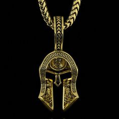 This solid gold and half paved diamond Spartan pendant is a symbol of Strength, Courage, Loyalty, and Power. The Yellow Gold Spartan Pendant was created for Free Men who demand the most of themselves and break the shackles of society. The inside of the helmet is beautifully sculpted with a Spartan shield and Spartan warriors bearing the swords. MATERIALS, WEIGHTS & MEASUREMENTS: Small Size: 14 karat gold weight is 11 grams and 18 karat gold weight is 13 grams. 55 VVS Colorless diamonds totaling Yellow Gold Symbolic Jewelry With Box Chain, Symbolic Yellow Gold Jewelry With Box Chain, Symbolic Diamond Pendant Jewelry, Luxury Collectible Bronze Jewelry, Ceremonial Engraved Diamond Jewelry, Symbolic White Gold Jewelry With Box Chain, Spiritual Diamond Jewelry With Engraving, Symbolic Medallion Jewelry With Box Chain, Spiritual Engraved Diamond Jewelry