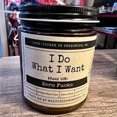 a jar of jam sitting on top of a wooden table