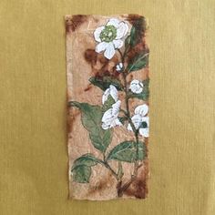 a piece of fabric with white flowers on it