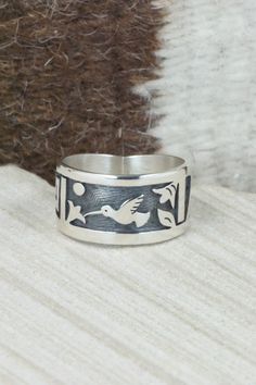 This sterling silver ring was made by Hopi silversmith Timothy Mowa. The inside is stamped sterling.Size: 12Length: 1"Free shipping on all orders! We ship with USPS and always include tracking. All orders ship within a day of payment.Returns are accepted up to 30 days after you receive your order. Just send us a message. Our shop offers cash back or store credit. The item must be returned in new condition. Oxidized Finish Southwestern Sterling Silver Bracelet, Western Style Sterling Silver Bracelet Gift, Stamped 925, Bohemian Hand-cast Sterling Silver Rings, Southwestern Style Nickel-free Sterling Silver Rings, Southwestern Sterling Silver Hand-strung Jewelry, Native American Jewelry, Free Jewelry, Sterling Silver Rings, Jewelry Watches