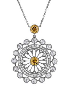 Round-cut brown diamonds center and top this elegant filigree pendant filled with white diamonds and strung upon a dainty 18-karat white-gold chain. 17 1/2" length Total diamond weight: 1.10ct. Color: G–H Clarity: VS 18k-white gold/diamond/brown diamond Made in the USA >Diamond Guide White Gold Diamond Pendant Necklace With Intricate Design, Luxury White Gold Celestial Diamond Necklace, Fine Jewelry Diamond Necklace With Moon Charm, Fine Jewelry Diamond Pendant With Intricate Design, Luxury Filigree Diamond Pendant Necklace, Edwardian Necklace, Filigree Necklaces, Diamond Guide, White Gold Chains