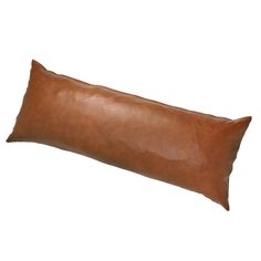 a brown leather pillow on a white background