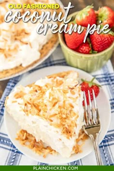 an old fashioned coconut cream pie on a plate with a fork and bowl of strawberries in the background