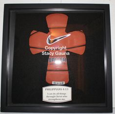 a display case with an orange nike jersey and name tag on the front that says, copynight stay gauna