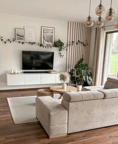 a living room filled with furniture and a flat screen tv