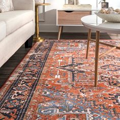 an orange and blue rug in a living room