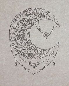 a drawing of a crescent moon with intricate designs on the back and sides, as well as an ornament