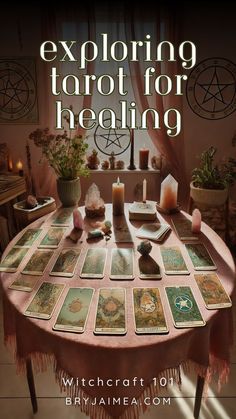 a table with cards and candles on it that says exploring tarot for healing