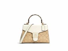 Luxury Medium Beige Bags, Medium Beige Shoulder Bag, Beige Rectangular Satchel With Branded Hardware, Elegant Medium Coach Bag, Medium Luxury Beige Bags, Beige Top Handle Satchel With Branded Hardware, Cream Satchel With Branded Hardware, Medium Beige Luxury Bags, Cream Satchel With Branded Hardware For Travel