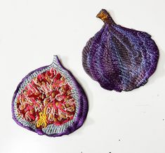 two pieces of art made out of yarn and fabric on a white surface, one with a purple flower