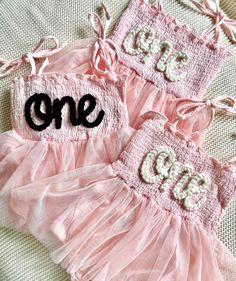 Our custom hand embroidered name tutus are sure to look adorable on the sweet little one in your life!  Give them as gifts for baby showers, name announcements, first birthday's, Xmas gifts, and more!  These tutu's are also perfect to wear for your little one's first birthday!  Just pick out the color tutu and yarn you want and leave the rest up to us!  Your little girl will look absolutely adorable in her StitchedxStacey custom tutu! Choose the color of your tutu romper in the above drop down. Cake Smash Dress, Birthday Romper, First Birthday Outfit, Baby Tutu, Embroidered Name, First Birthday Outfits, Baby Sweaters, Custom Baby