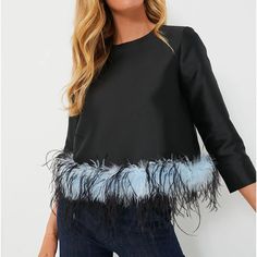 This Oh-So Chic Piece Is On The Top Of Our Lists! Perfect For A Girls Night Out, The Sabrina Blouse Features A Fun Feather Trim, Round Neckline, And Three-Quarter Length Sleeves. A Simple Black Silhouette With A Flirty Detail, We Are Styling This Wardrobe Winner With Black Pants And Heels For An Electric Ensemble. Round Neckline Three-Quarter Length Sleeves Back Zip Feather Trimmed Hemline Slightly Cropped Lined Material: 100% Polyester, Lining: 97% Polyester, 3% Spandex Care: Dry Clean Only **A Feather Trim Tops For Fall Party, Fall Party Tops With Feather Trim, Long Sleeve Tops With Feather Trim For Evening, Feather Trim Tops For Night Out In Spring, Spring Night Out Tops With Feather Trim, Spring Evening Tops With Feather Trim, Elegant Party Top With Feather Trim, Elegant Party Tops With Feather Trim, Black Feather Trim Top For Evening