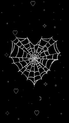 a spider web on a black background with hearts